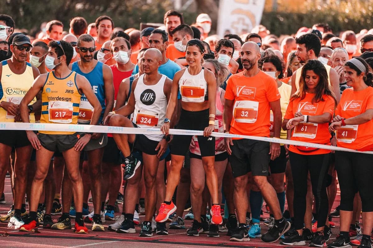 Runners gathered behind the start line at a road race