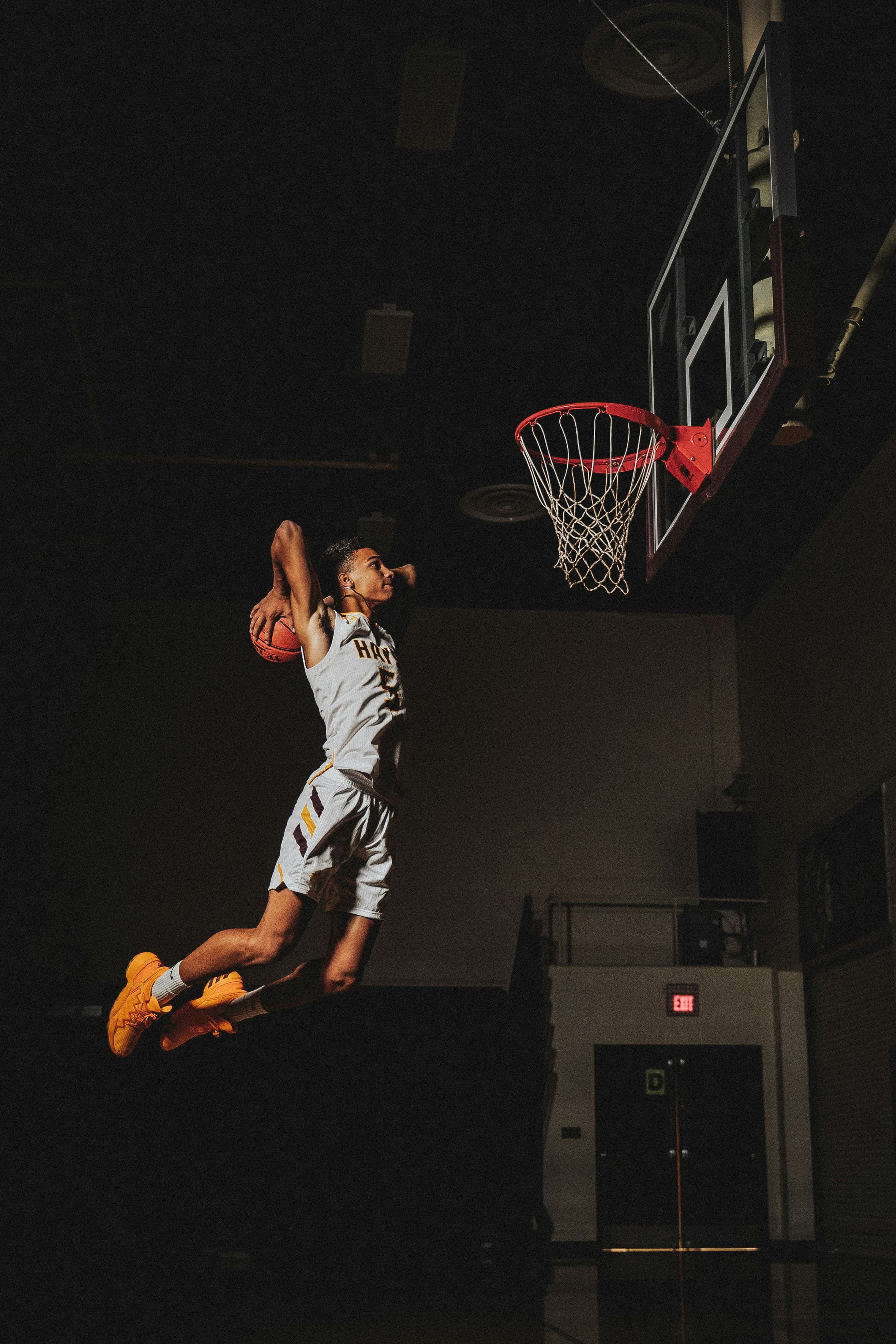 Basketball player jumping toward the basket